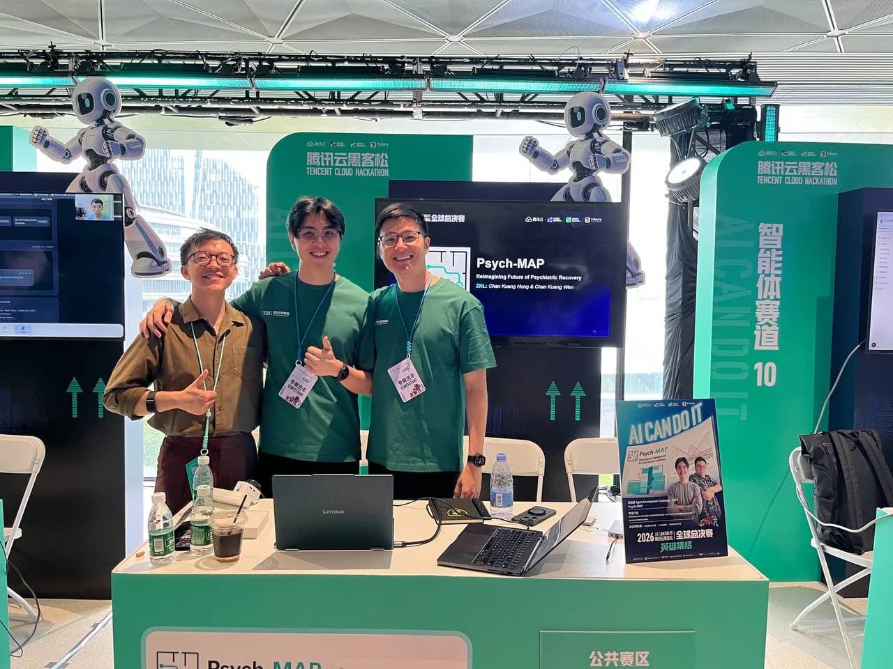 Three participants smiling at the camera at the Psych-MAP booth during Tencent Cloud’s global finals